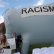 Activists hold a giant white elephant with the word “racism” on it outside the CNBC Republican Presidential Debate on Oct. 28, 2015, in Boulder, Colo.
Andrew Burton/Getty Images